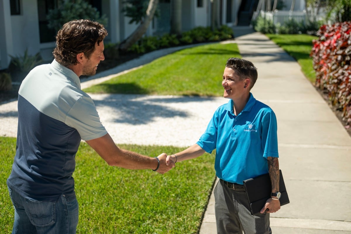 Account manager and property manager commercial shaking hands
