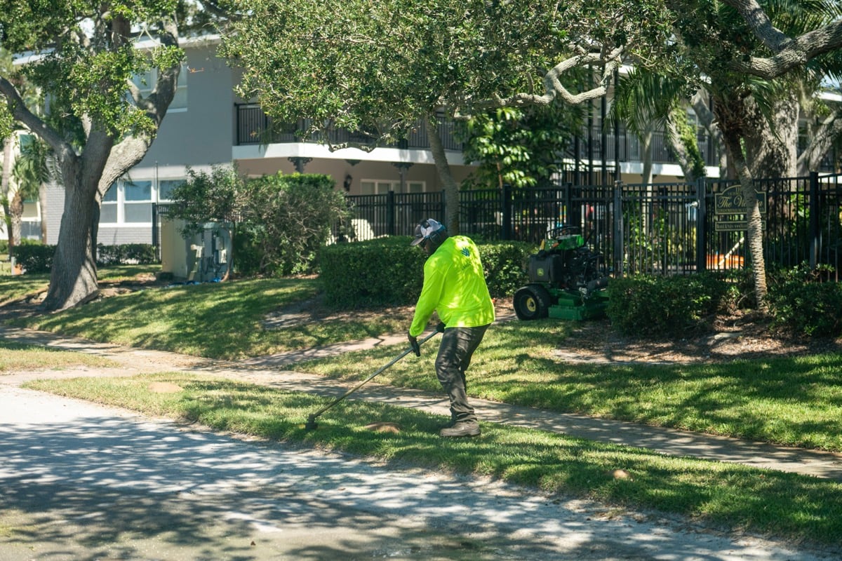 Crew maintenace landscape weed wacking 1