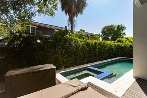 pool backyard shrub hedge deck