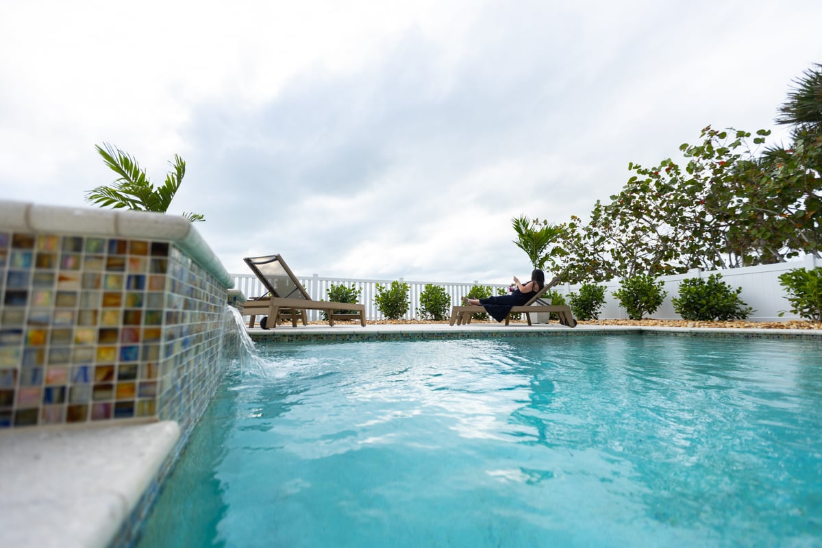 pool customer client tile waterfall shrubs