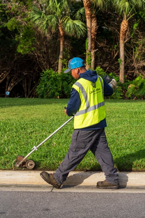 crew edging along grass and sidewalk