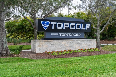 landscaping flower beds around Top Golf entrance sign 