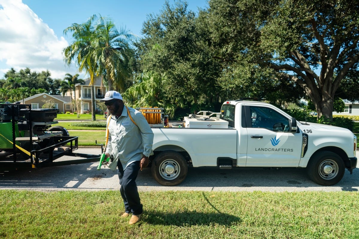 residential landscape maintenance crew treating lawn 1