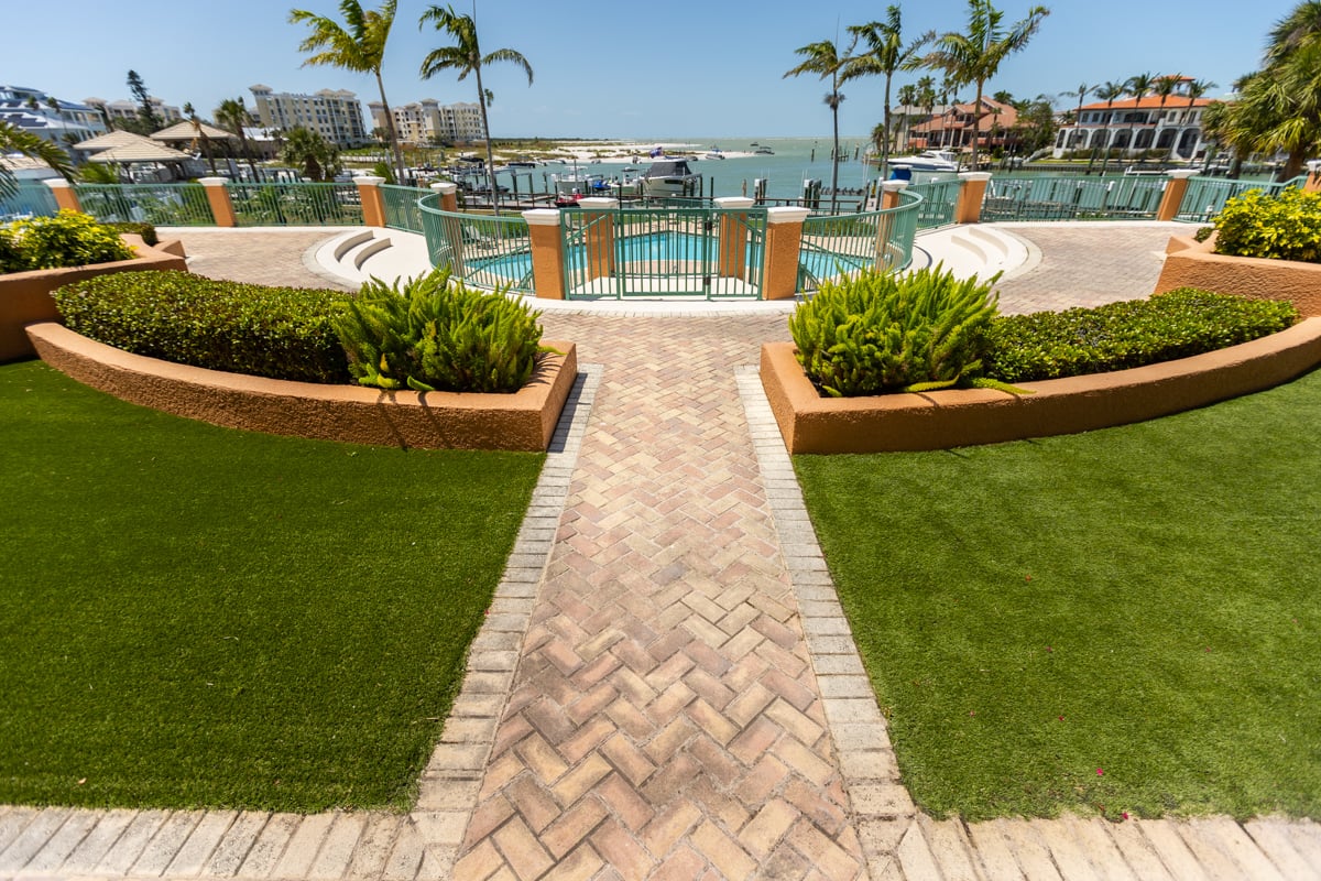 brick paver patio planting beds condos hoa commercial grass