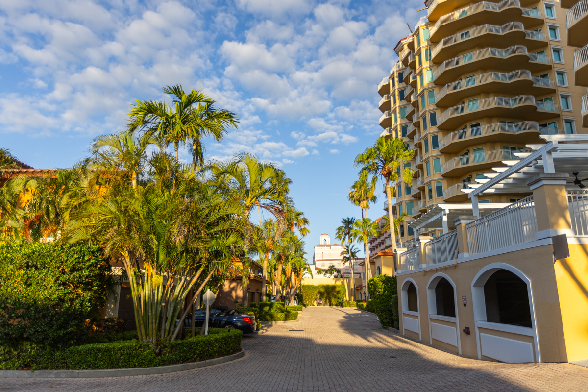 high rise condo hoa entrance building plants