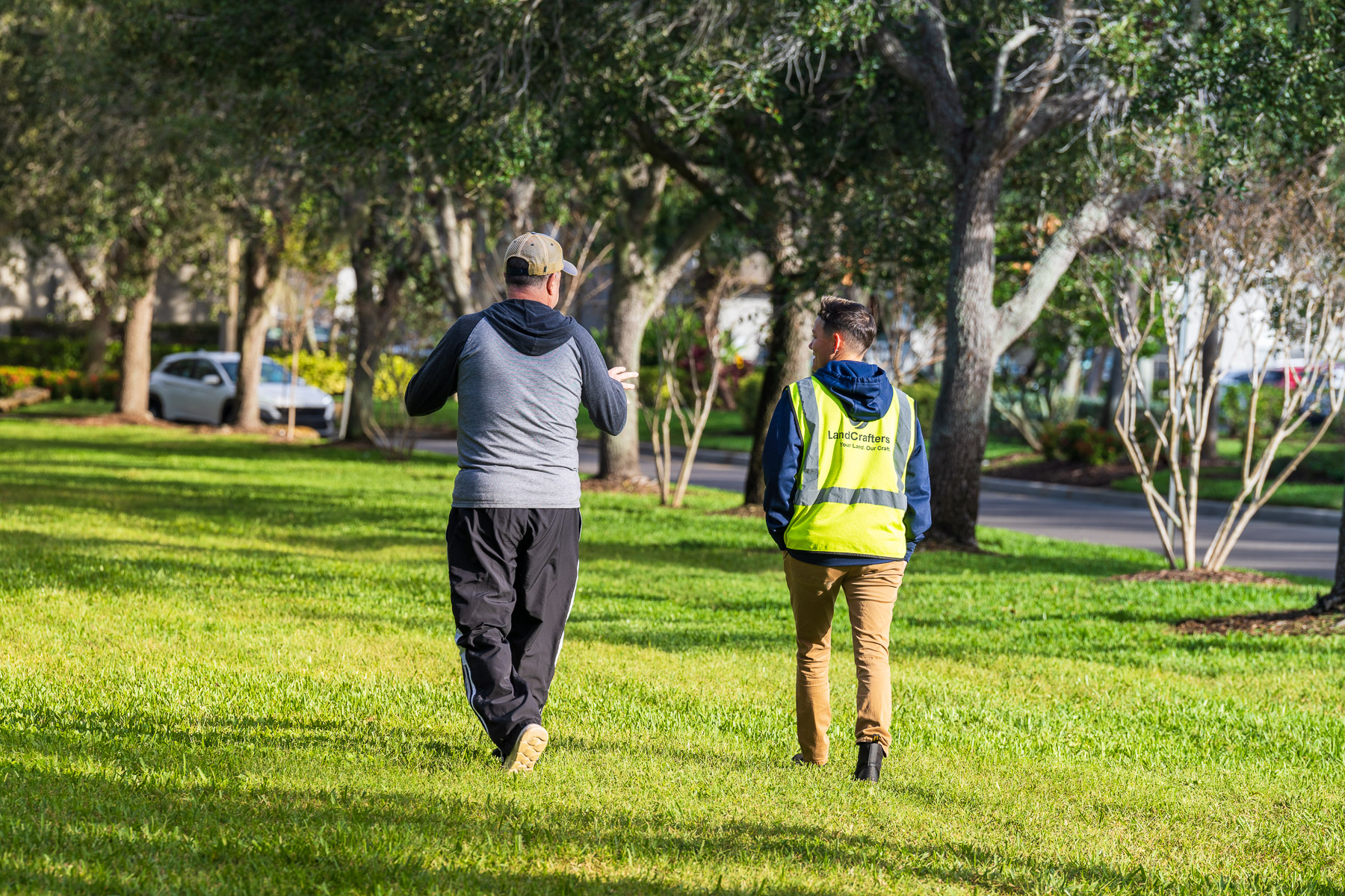 Account manager walking with HOA board member around property 2