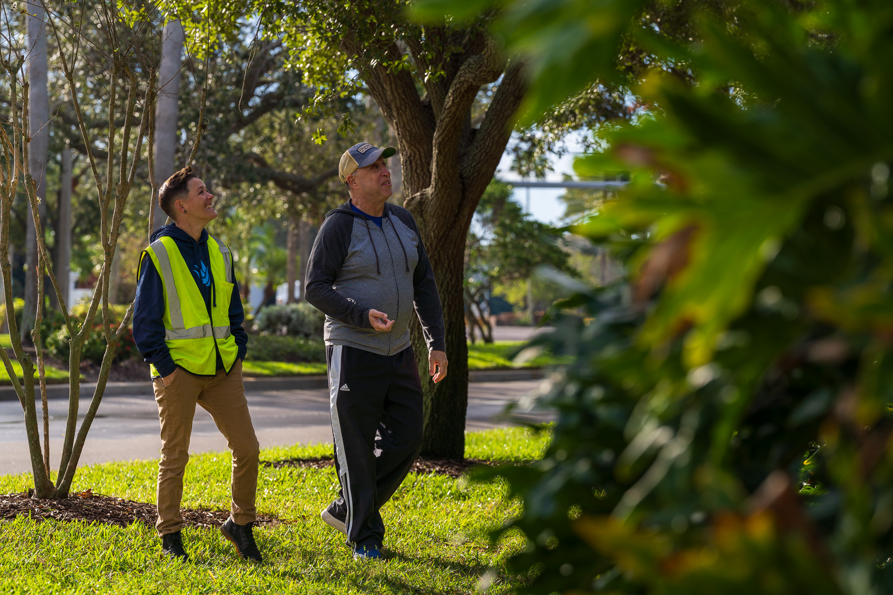 Account manager walking with HOA board member around property