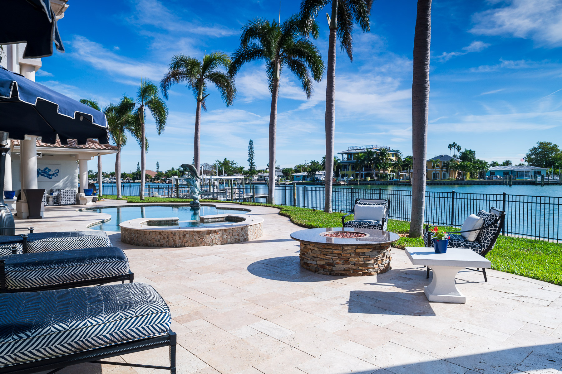 HOA common area landscape with pool and palm trees