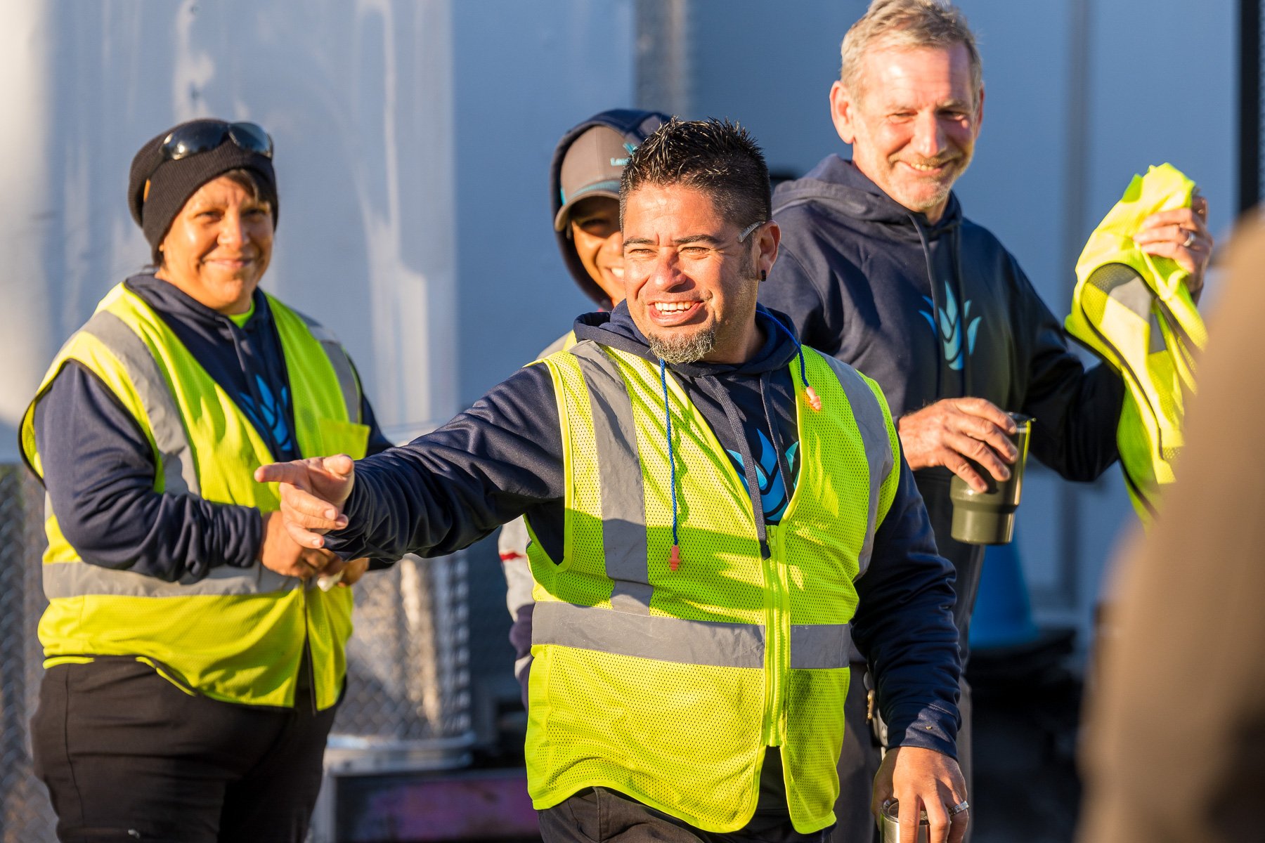 crew in yard for morning meeting