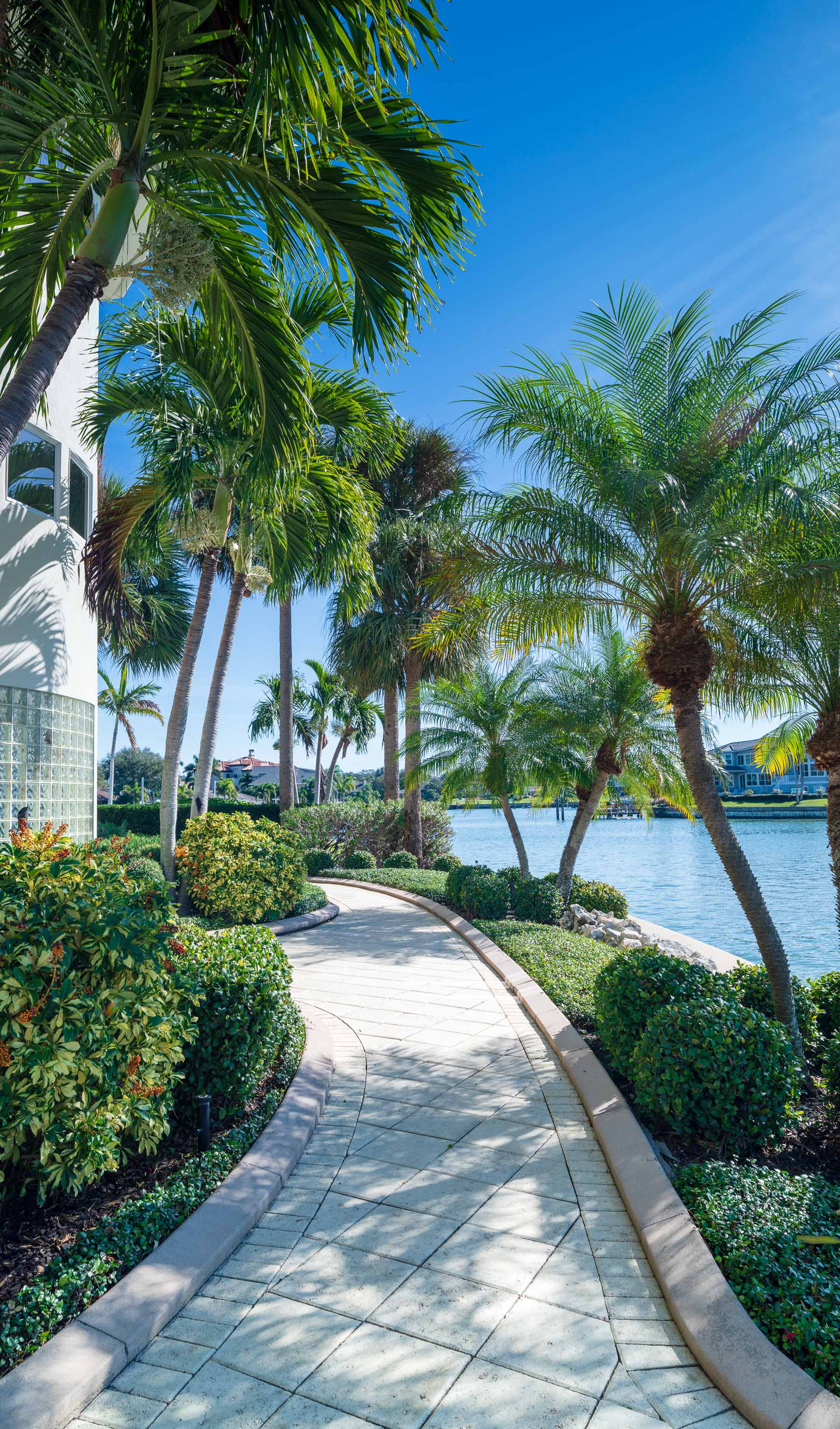 residential landscape mainteance garden beds along water